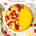 Lemon raspberry tart on a white plate.