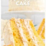 A slice of yellow Pig Pickin’ cake with creamy frosting, garnished with an orange slice.