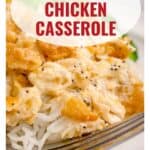 Close-up of poppy seed chicken casserole served on rice with a fork, and text overlay of the dish name.
