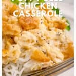 Close-up of poppy seed chicken casserole served over rice, with a fork on the plate, recipe text overlaid.