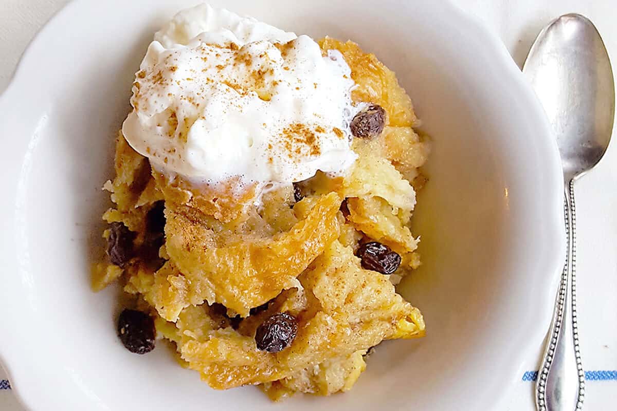 A serving of bread pudding in a bowl.