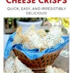 A basket of Asiago cheese crisps with herbs, served on a blue napkin, and glasses of white wine in the background.