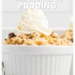 White ramekin filled with baked rice pudding, topped with whipped cream and a crumbly topping.