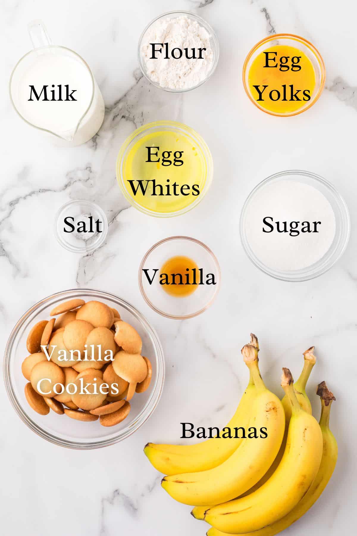 ingredients for Southern Banana Pudding on a marble background in separate containers