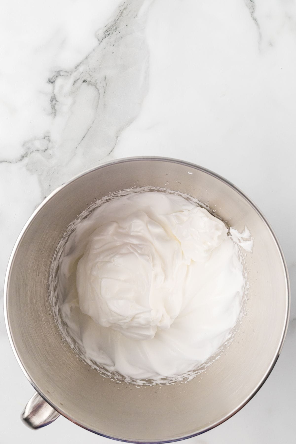 Meringue after being whipped in a stand mixer.