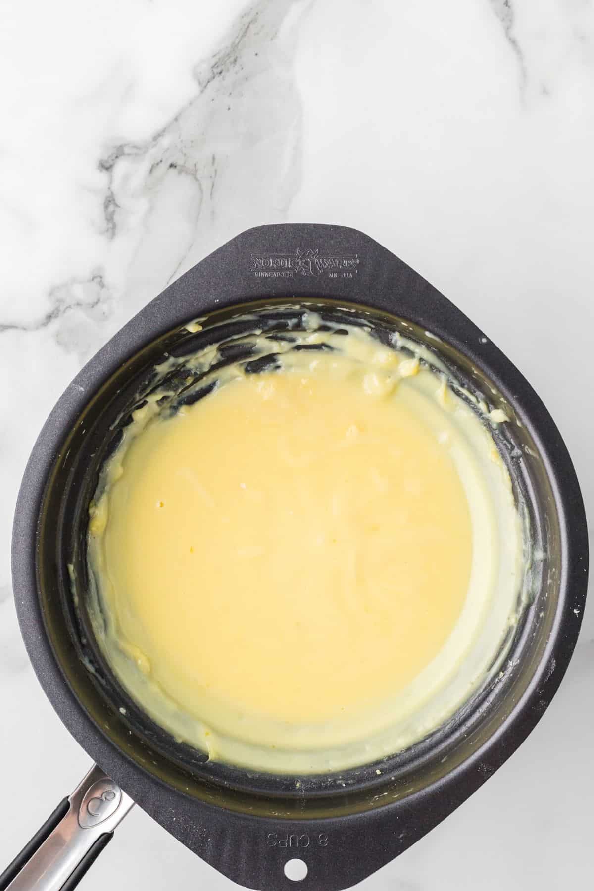 Pudding being cooked in a double boiler.
