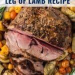 Sliced roasted boneless leg of lamb on a platter with vegetables, text overlaying the image.