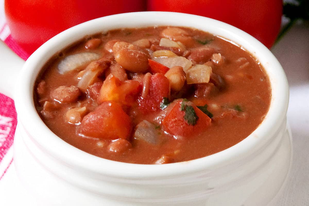 A white bowl filled with cowgirl beans.