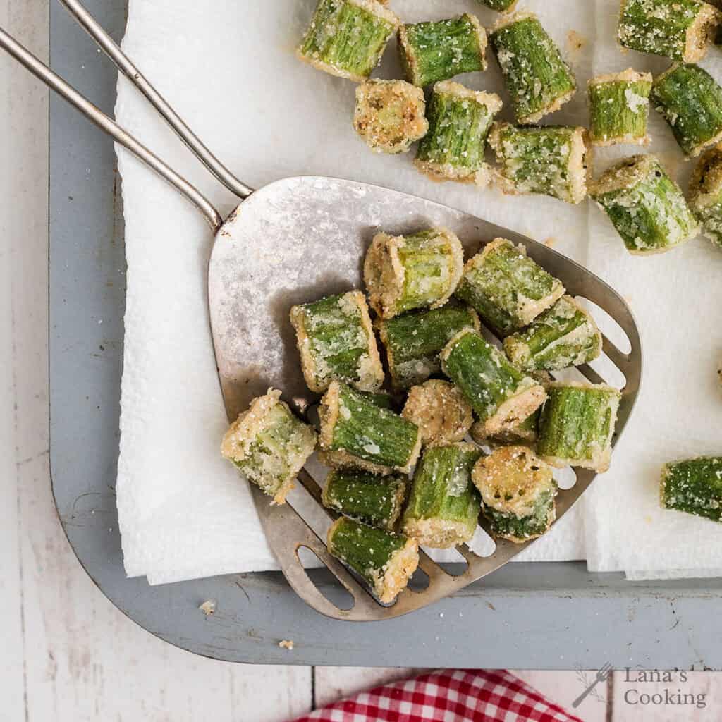 Finished fried okra draining on paper towels.