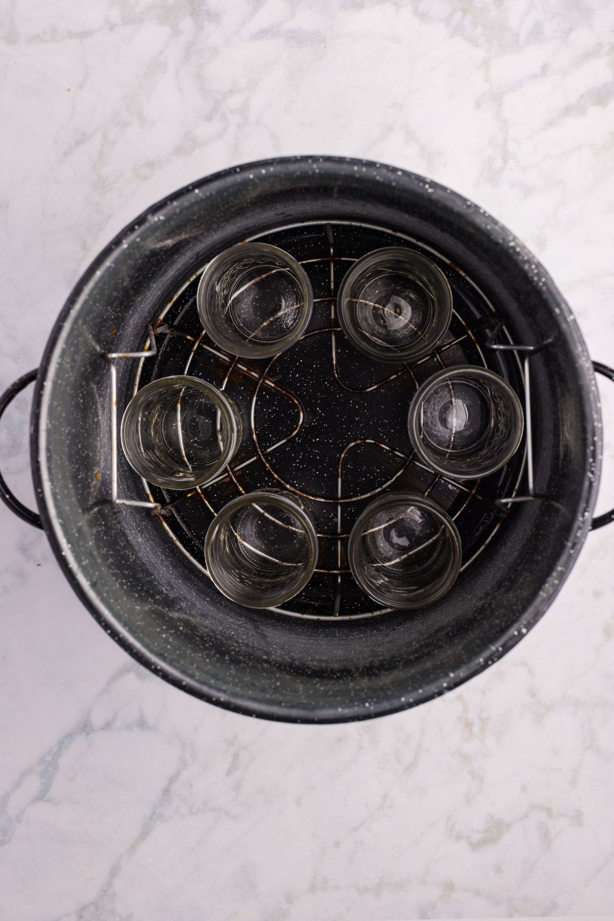 Clean, washed jars kept hot in the canner.