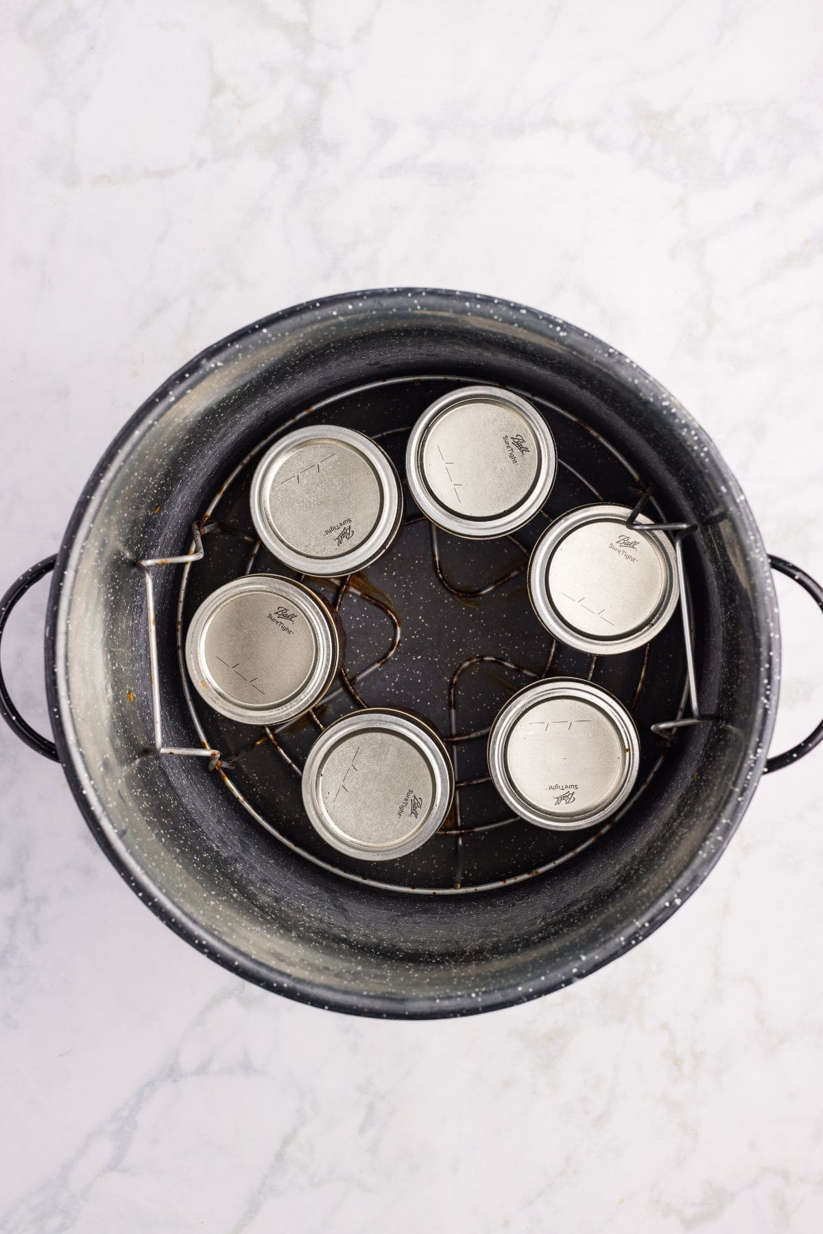 Filled jars in the canner.
