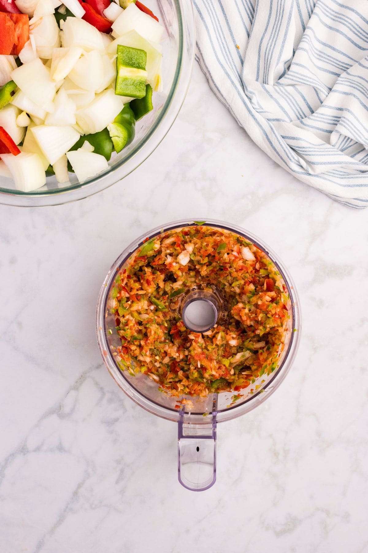 Chopped peppers and onions in a food processor.