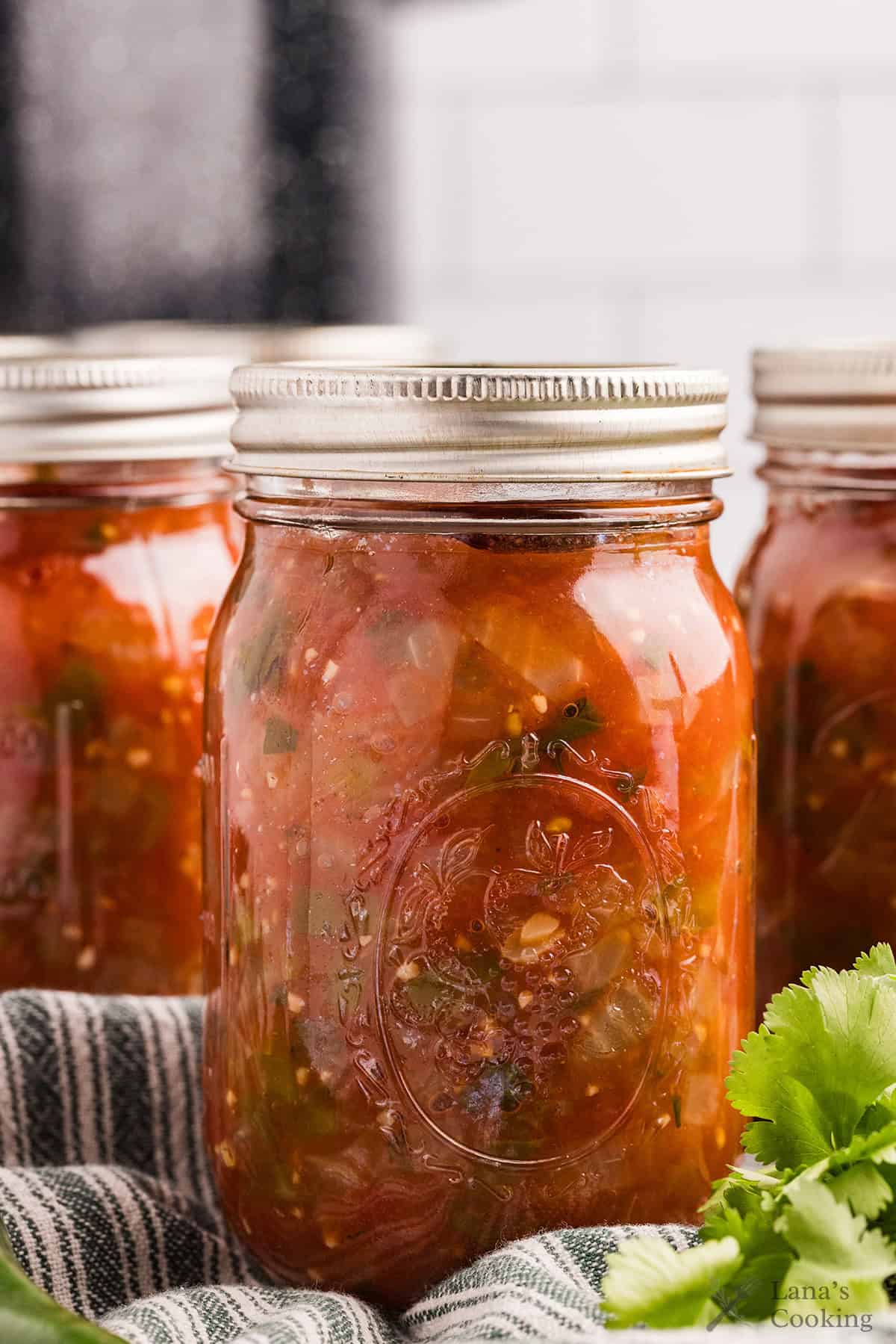 Finished jars of processed basic salsa.