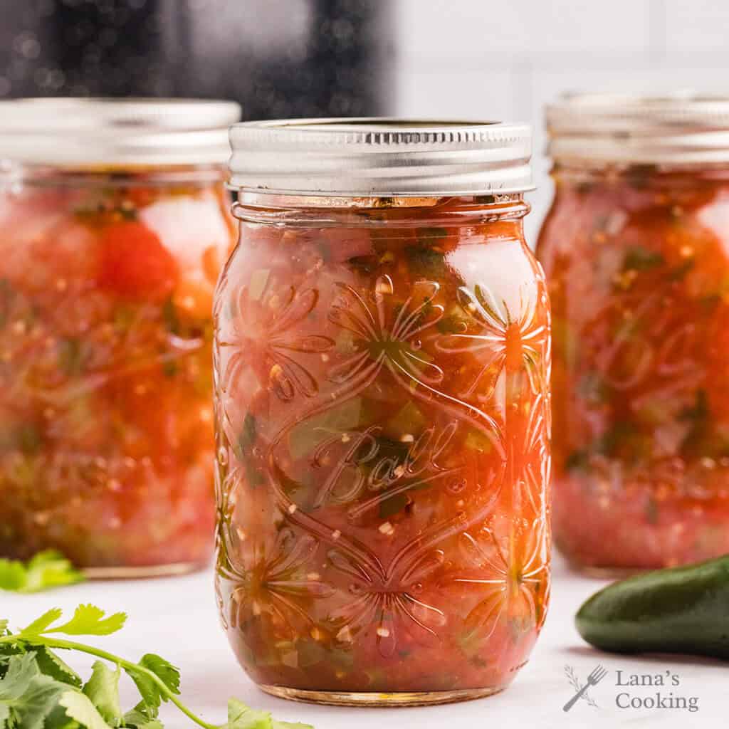 Finished jars of processed basic salsa.