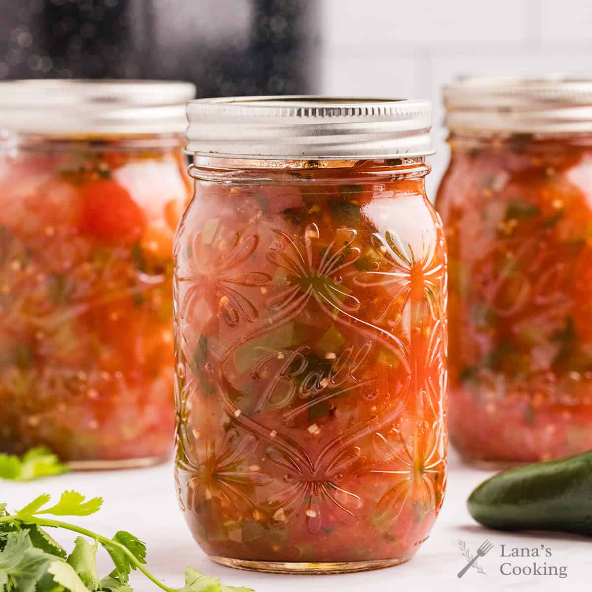 Finished jars of processed basic salsa.