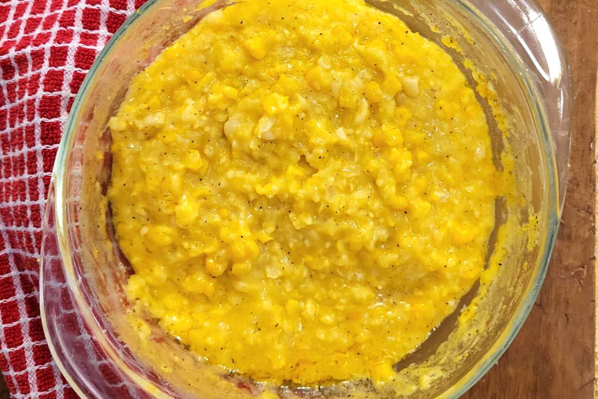 Creamed corn in a glass bowl.
