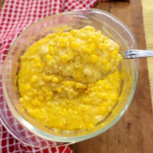 Creamed corn in a glass bowl.