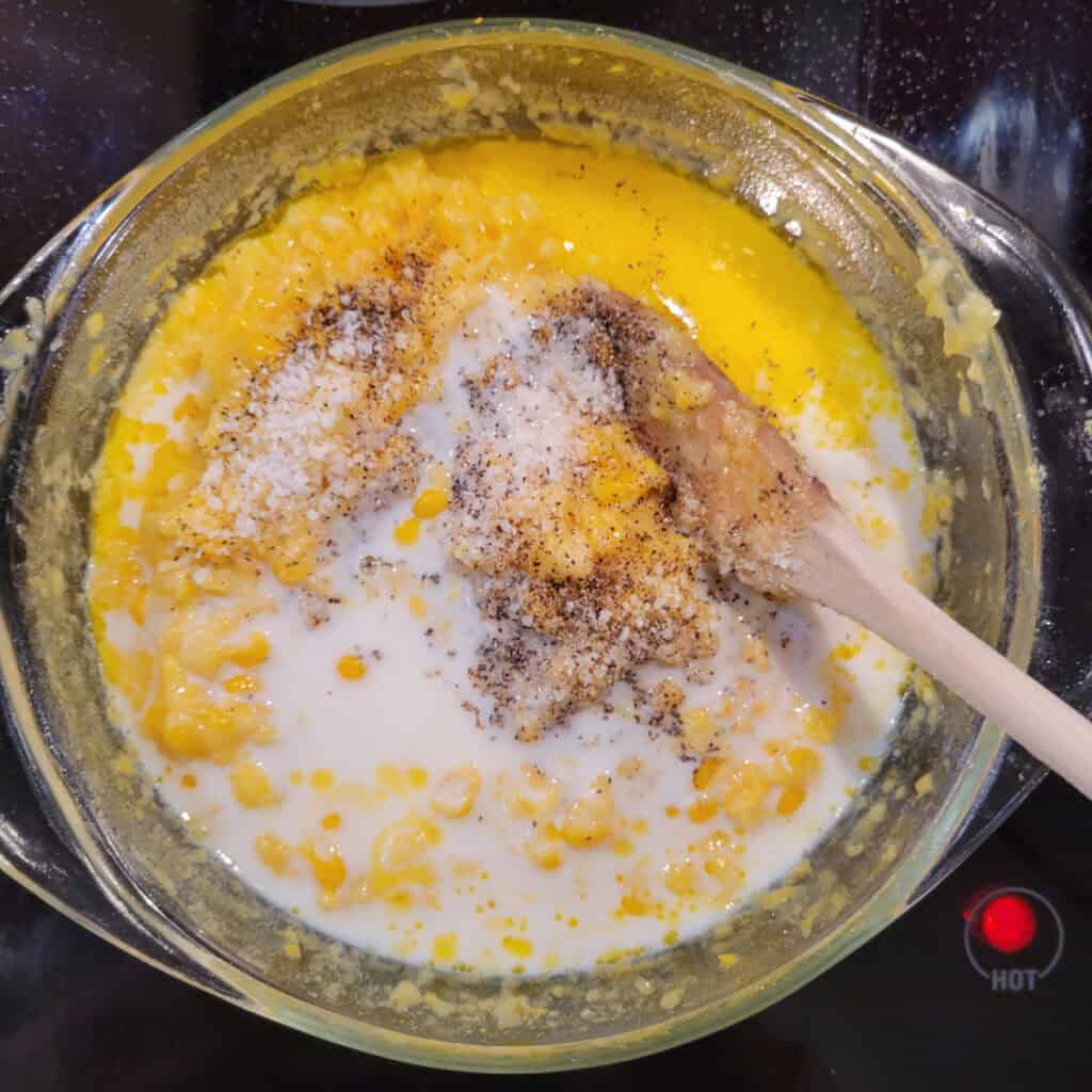 Adding milk, salt, and pepper before the final 5 minutes of cooking.