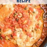 Tilapia fillets simmer in tomato sauce with capers and olives; text reads Tilapia Veracruz Recipe.