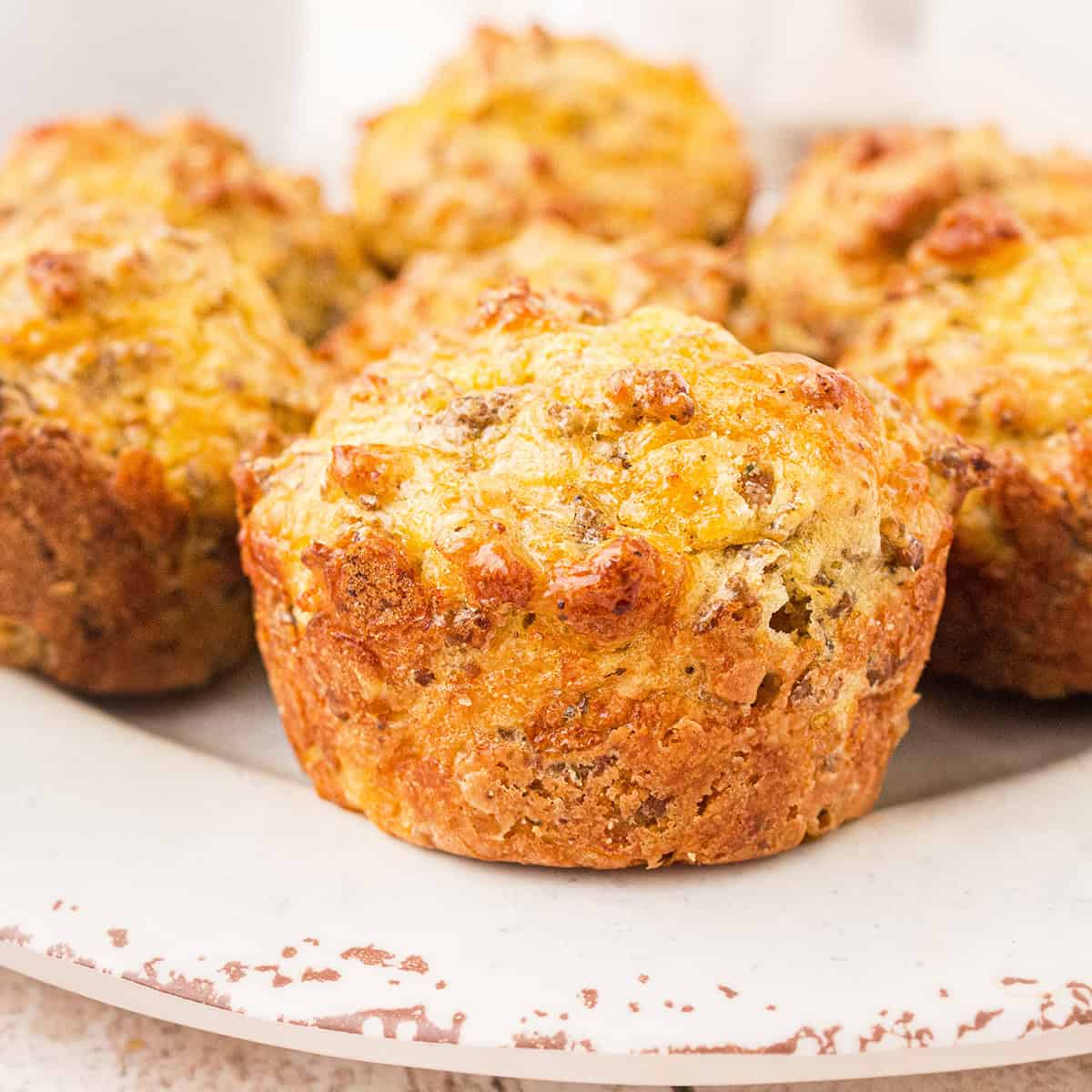 Finished muffins on a white plate.