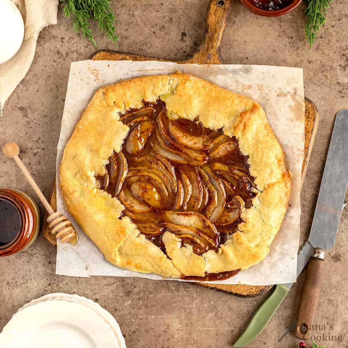 Baked pear galette on a wooden surface.
