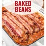 A casserole dish of baked beans topped with strips of bacon, labeled Southern Baked Beans.