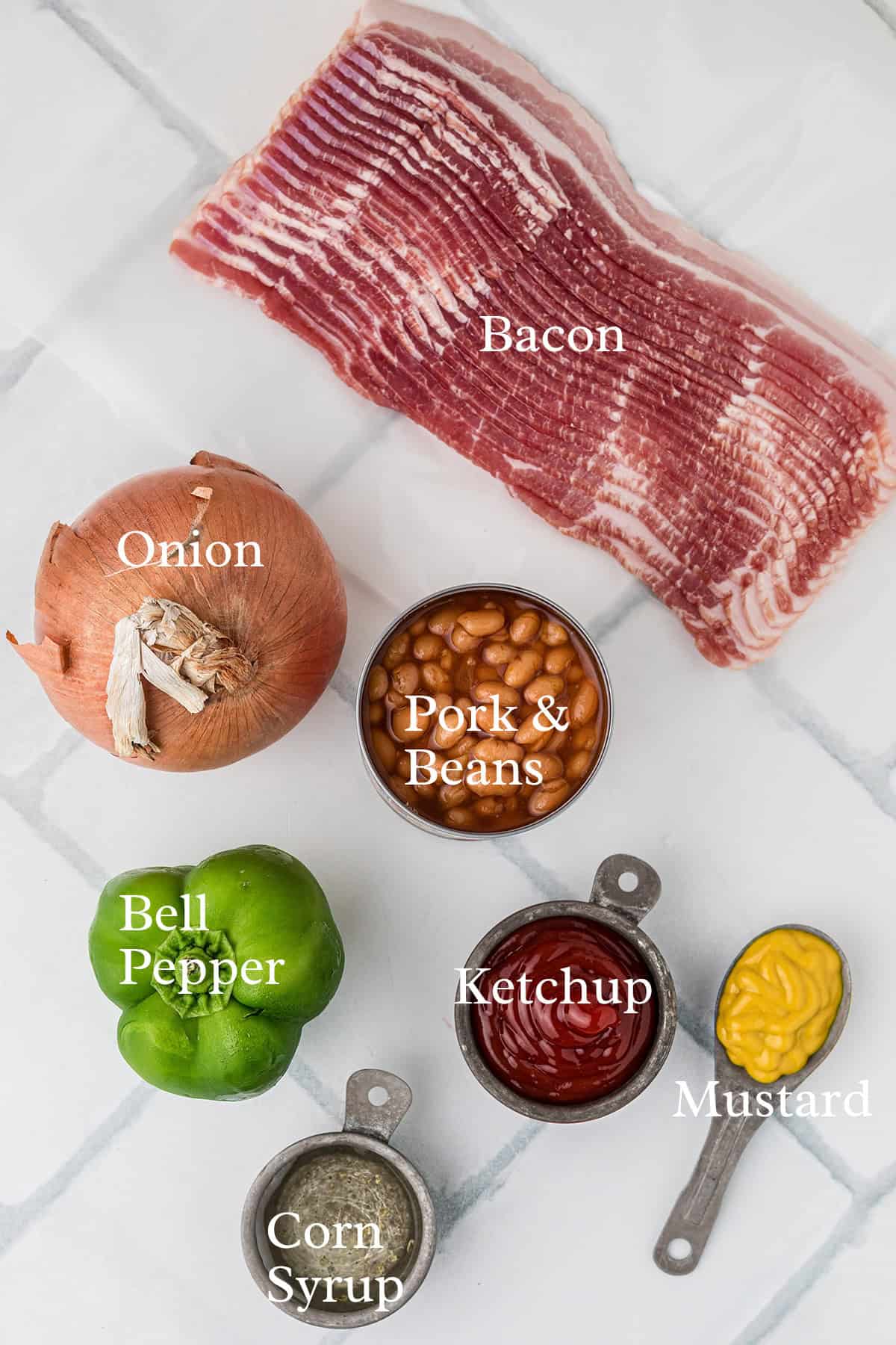 Bacon, onion, bell pepper, pork & beans, ketchup, mustard, and corn syrup on a white background.
