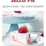 A slice of strawberry Jello pie with a fresh strawberry on top, on a plate with a fork.