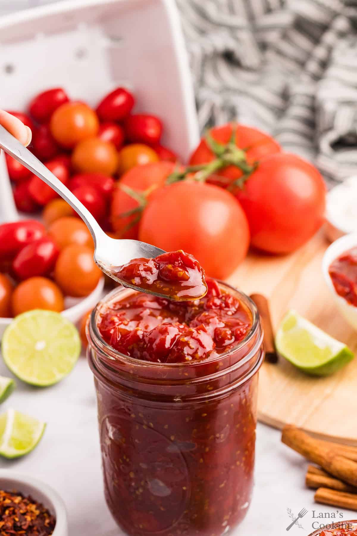 Finished tomato jam in a glass jar.