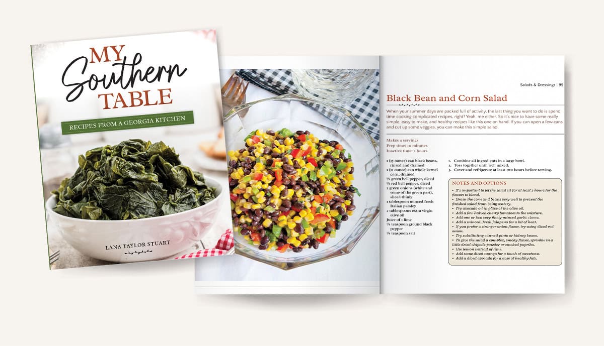 A cookbook cover titled My Southern Table: Recipes from a Georgia Kitchen is shown next to an open page featuring a photo of black bean and corn salad, along with the corresponding recipe and notes.
