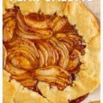 Golden-brown pear galette with sliced pears and glaze on a rustic crust, labeled as a fall dessert.