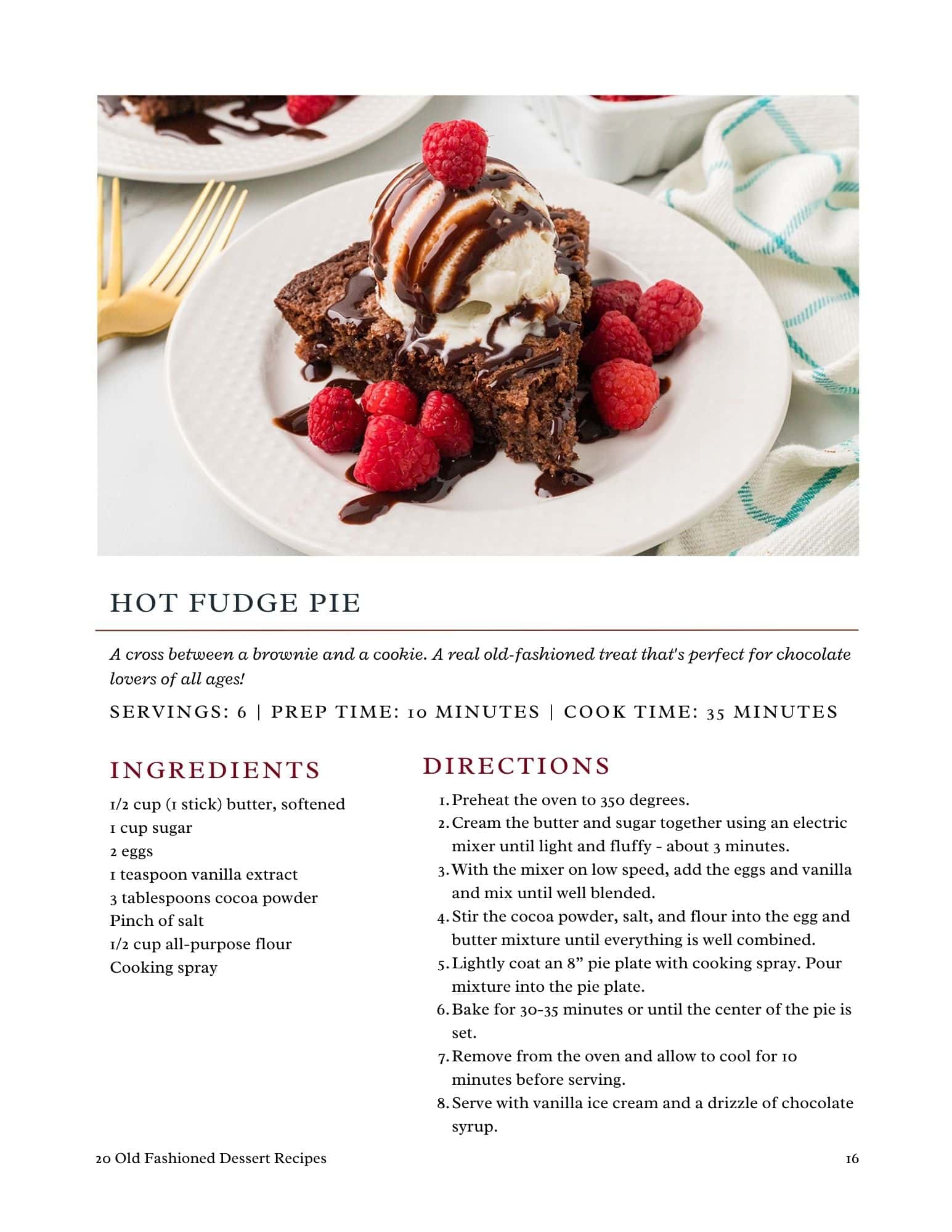 A slice of hot fudge pie topped with a scoop of vanilla ice cream and drizzled with chocolate sauce sits on a white plate with a fork; a strawberry and chocolate chips garnish the plate.