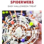 A hand holds a pretzel spiderweb with white chocolate and colorful candies; Halloween treat text above.