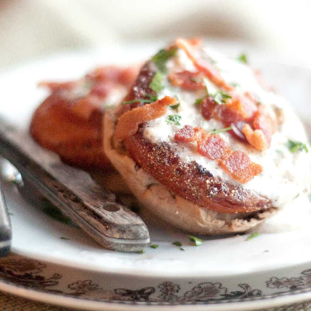 Fried red tomatoes with bacon gravy served over a toasted English muffin.