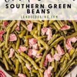 A skillet filled with Southern-style green beans and chunks of ham, with text Old Fashioned Southern Green Beans.