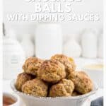 A bowl of sausage balls with dipping sauces on a table, text overlay promotes a classic sausage balls recipe.