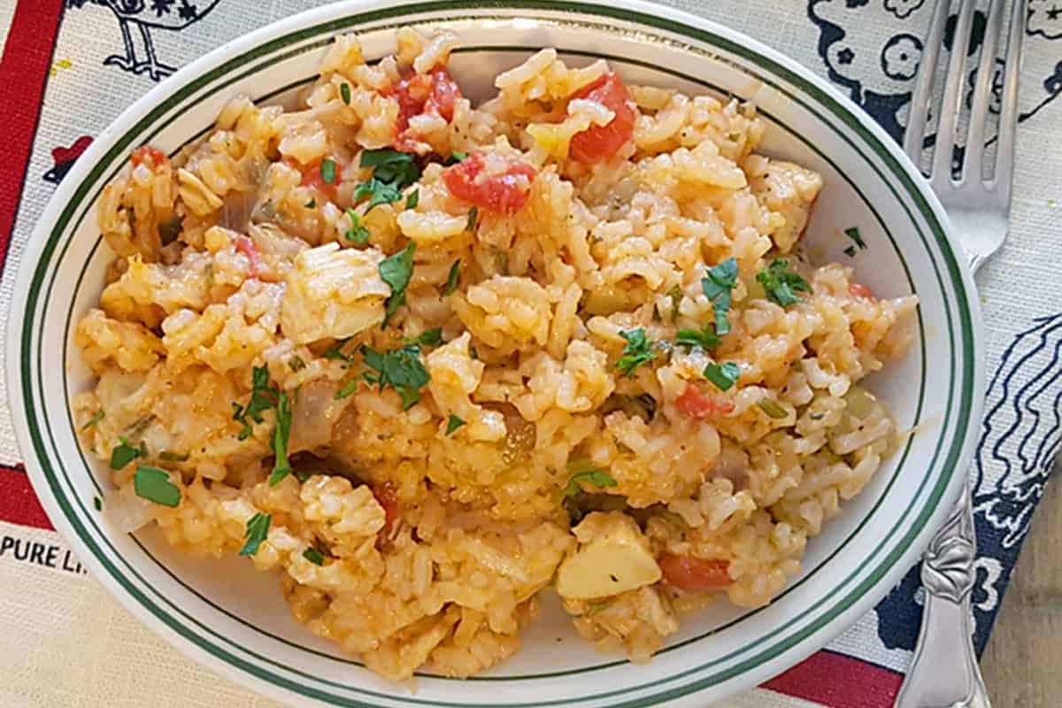 A serving of Charleston Red Rice in a white bowl.