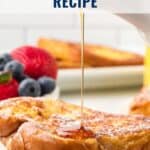 A closeup of French toast with syrup being poured, berries on the side, and text: Easy French Toast Recipe.