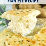 A serving of creamy fish pie topped with golden mashed potatoes, with potatoes in the background.