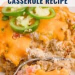 A cheesy casserole topped with sliced jalapeños, with a fork taking a bite. Text reads John Wayne Casserole Recipe.