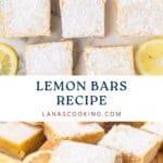 Lemon bars dusted with powdered sugar, surrounded by lemon slices on a wooden board and white surface.