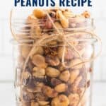 A mason jar filled with sweet and spicy peanuts, tied with twine, on a white background.