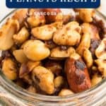 A jar filled with sweet and spicy seasoned peanuts, labeled as a recipe from lanascooking.com.