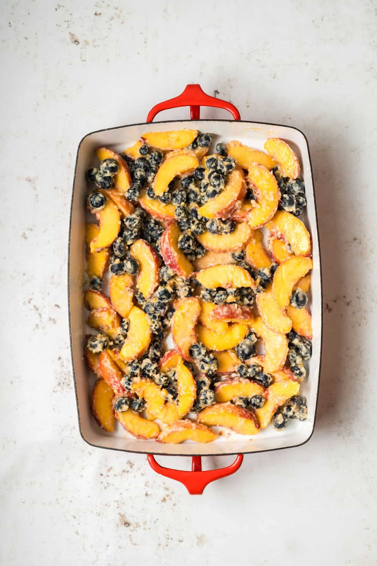 Fruit mixture in a prepared baking dish.