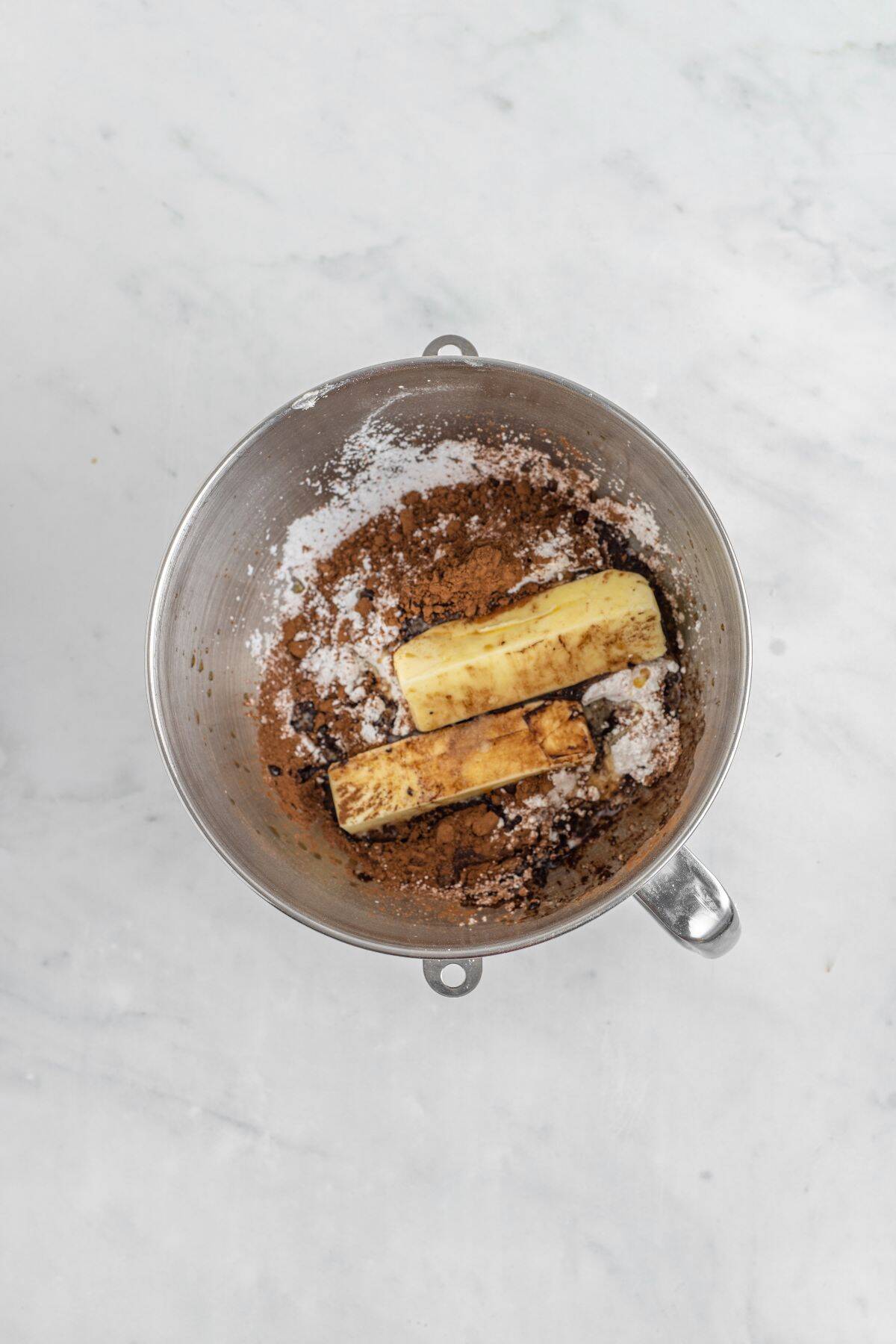 Ingredients for chocolate filling in a stand mixer bowl.