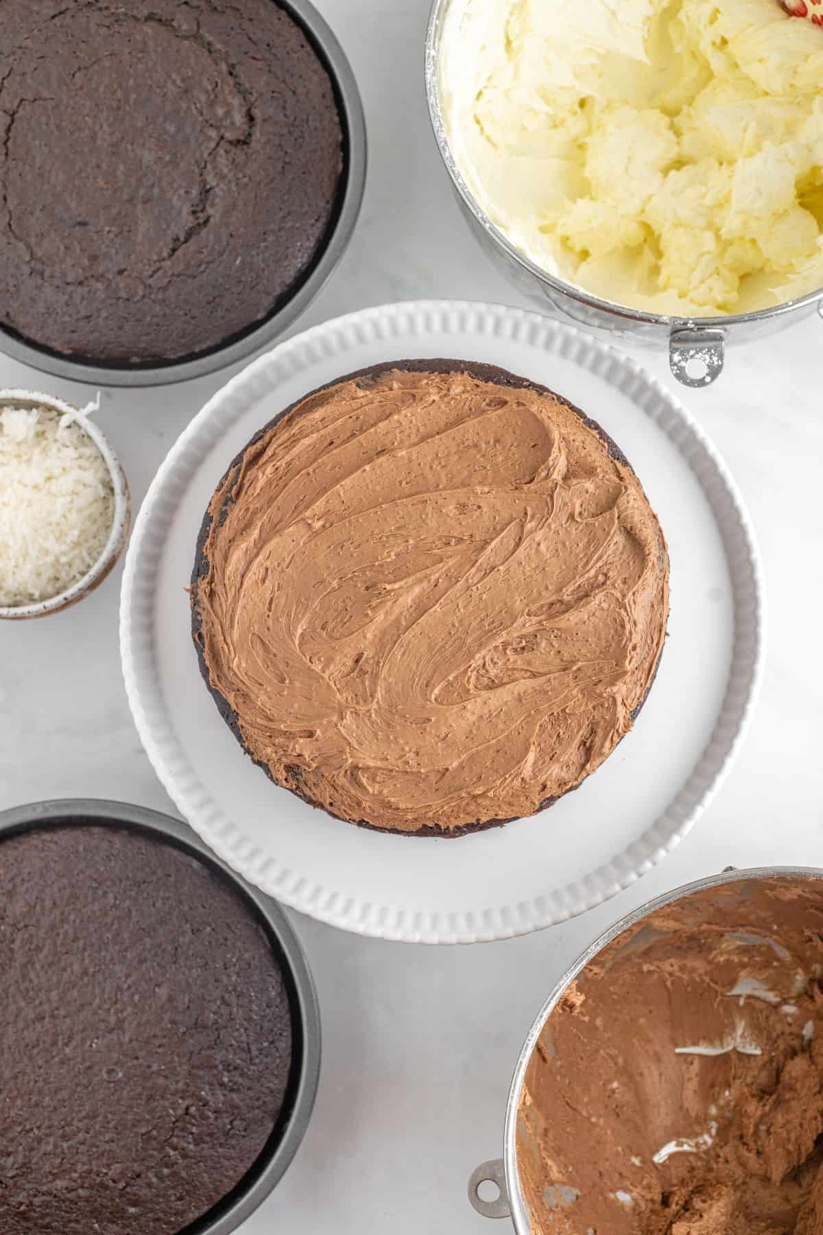 Chocolate filling added to first layer.