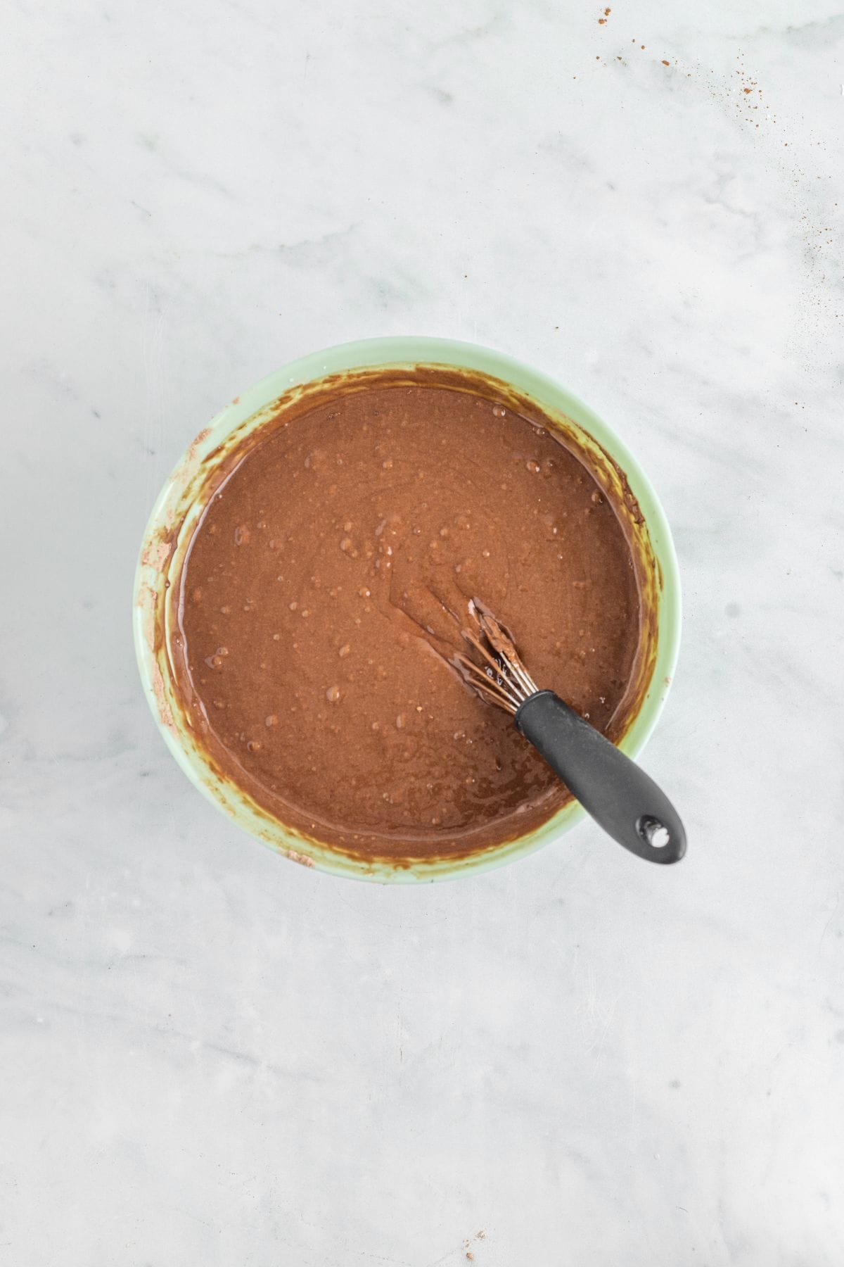 Hot water added to the cake layer mixture.