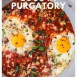 Skillet with eggs cooked in tomato sauce, topped with herbs and spices. Text: Eggs in Purgatory recipe.