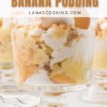 A glass dish filled with layers of banana pudding, vanilla wafers, and meringue on a white surface.