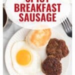 Plate with sunny-side-up egg, biscuit, and sausage patties, with text: Spicy Breakfast Sausage.